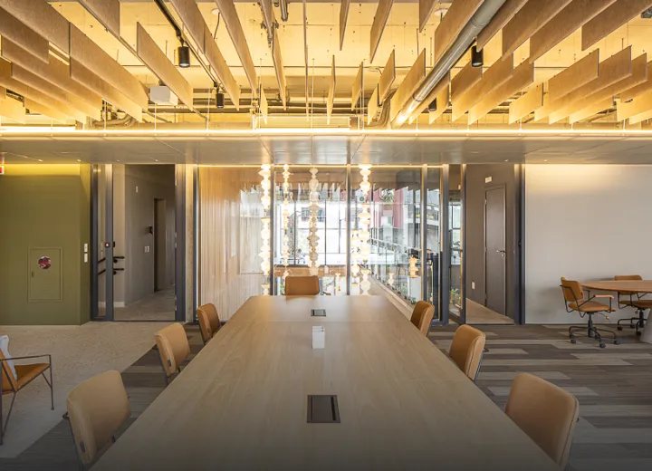 Coworking space at Ayra Pinheiros with communal desks, private offices, and meeting rooms